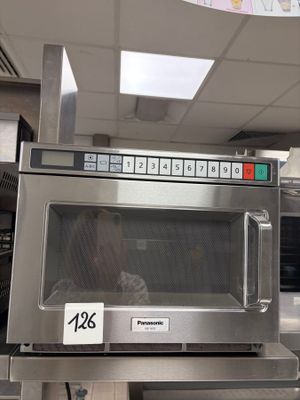 a microwave that is sitting on a counter in a store