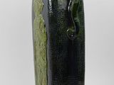 a black and green vase on a white background