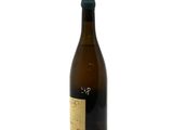 a bottle of wine sitting on top of a white table