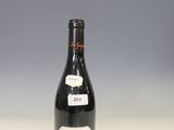 a bottle of wine that is sitting on a table