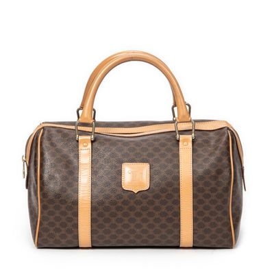 a brown and tan handbag on a white background