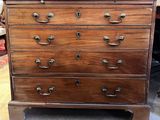 a wooden chest of drawers with many drawers on top of it