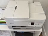 a printer that is sitting on top of a shelf