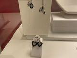 a display of jewelry on display in a glass case