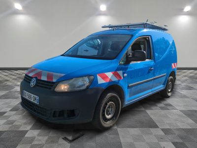 the blue van is parked on a checkered floor in a room