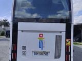 a white bus that is parked on the side of the road