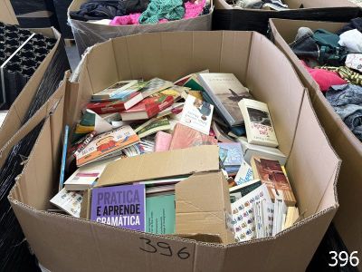 many boxes of books sitting on the floor next to each other