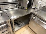 many stainless steel appliances on the counter in the kitchen