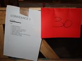 a picture of a red and white sign and a red and white sign on a wooden table