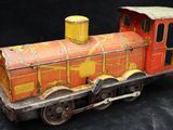 a toy train that is sitting on a black surface