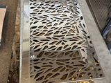 a metal grate on the ground next to a box