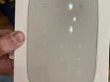 someone is holding a box with a keypad plus in it