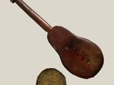 a wooden instrument with a wooden handle next to a metal object