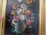 un tableau représentant un vase de fleurs dans un cadre doré