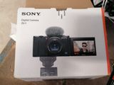 a box with a digital camera inside of it
