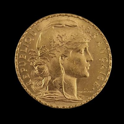 an image of a gold coin with a woman ' s head on it