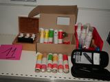 a box of paint and other supplies on a table