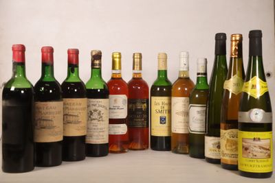 many bottles of wine that are lined up on a shelf