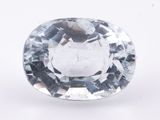 a close up of a white diamond on a white surface