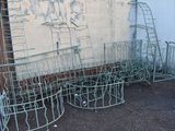 a lot of metal baskets that are outside of a building