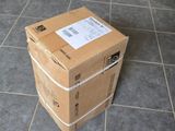 boxes stacked on top of each other on a tiled floor