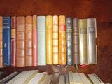 a lot of books that are sitting on a shelf
