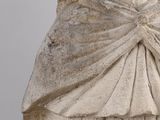 a statue of a woman with a shaw around her neck