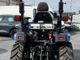 an image of a tractor parked in a parking lot