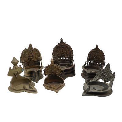 several different types of metal items are displayed on a white surface