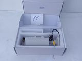 a white box with a bottle of water inside of it