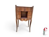 an image of a small wooden cabinet with drawers and a shelf