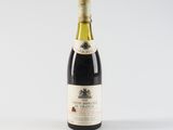 a bottle of wine that is sitting on a table