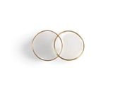 a pair of white and gold rings on a white surface