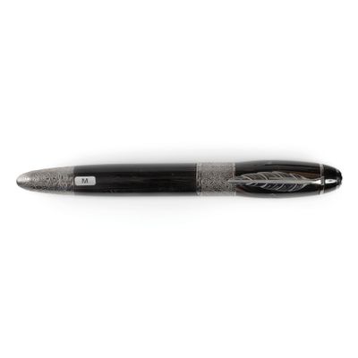 a close up of a pen on a white surface with a white background