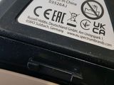 a close up of a cell phone with a sticker on it