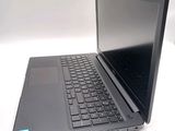 a laptop computer sitting on top of a white table