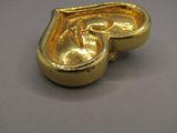 a gold object that is sitting on a table
