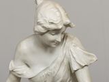 marble statue of a woman holding a bowl of fruit