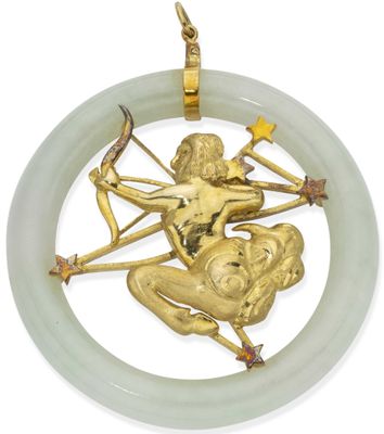 a close up of a gold plated pendant with a woman on it