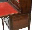 a small desk with a mirror on top of it