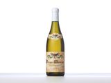 an image of a bottle of wine sitting on top of a table