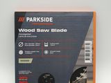 a close up of a box of wood saw blades on a white surface