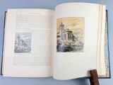 an open book with a picture of a building on it