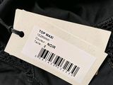 the label on the top of a black jacket is attached to a barcode