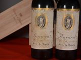 three bottles of wine sitting next to each other on a table