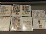 many different types of stamps on the pages of a book