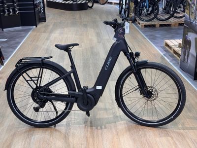 an image of a black electric bike on display in a store