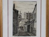 framed drawing of a street scene with buildings and a clock tower