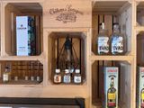 many bottles of liquor on the shelves in the room