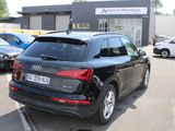 a black audi suv parked in a parking lot